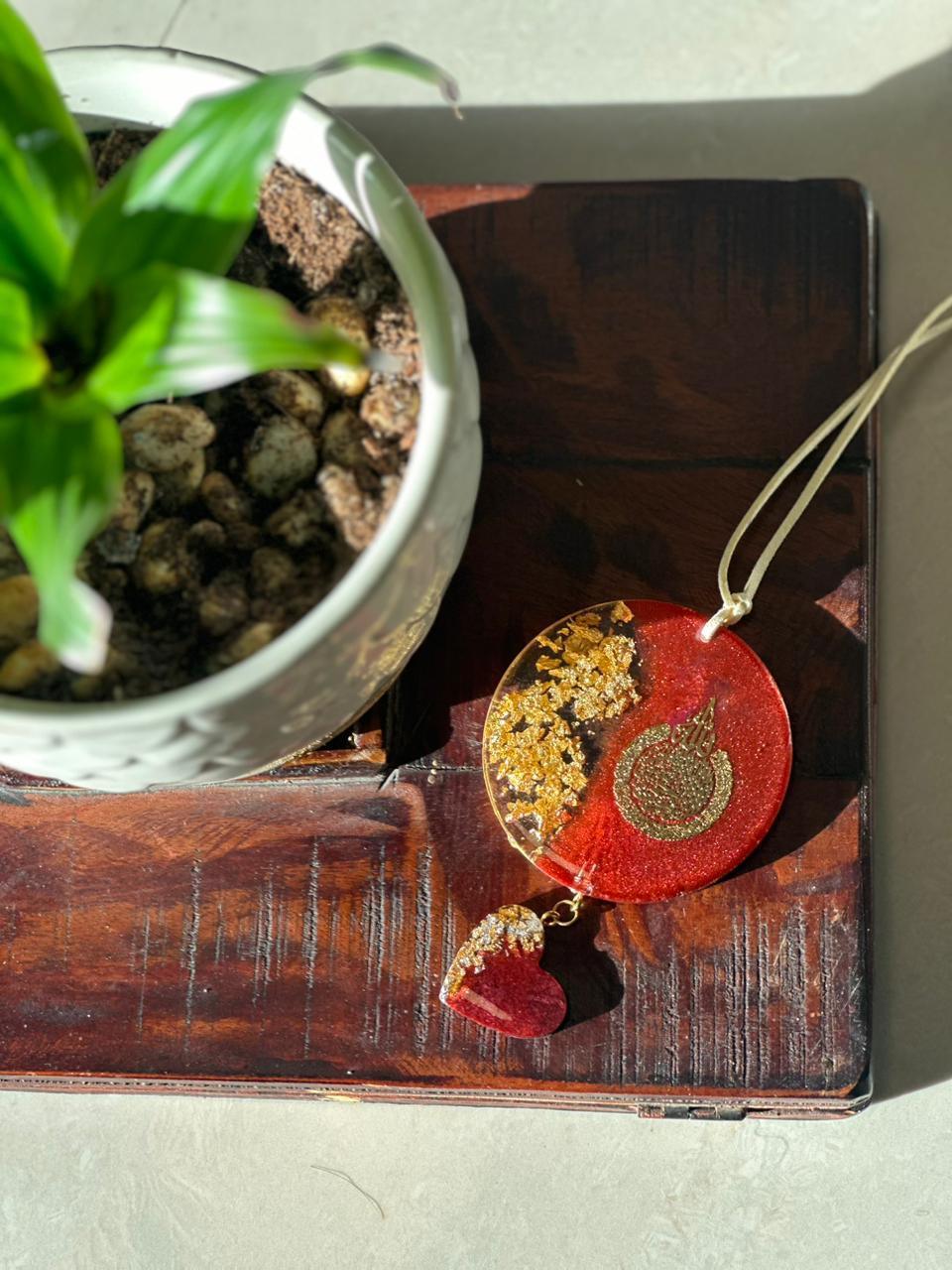 Top View car hanging ornament next to a plant