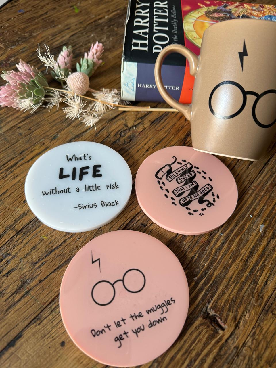 Photo showing coasters with Harrypotter quotes Written on them