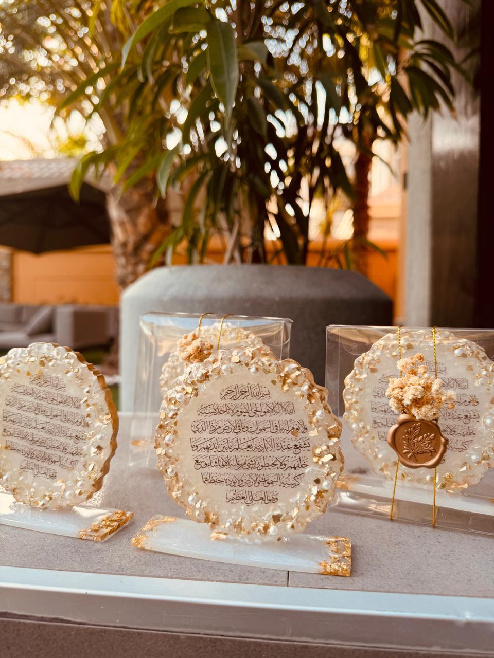 Front view of 3 Hajj ummrah Favors on a table