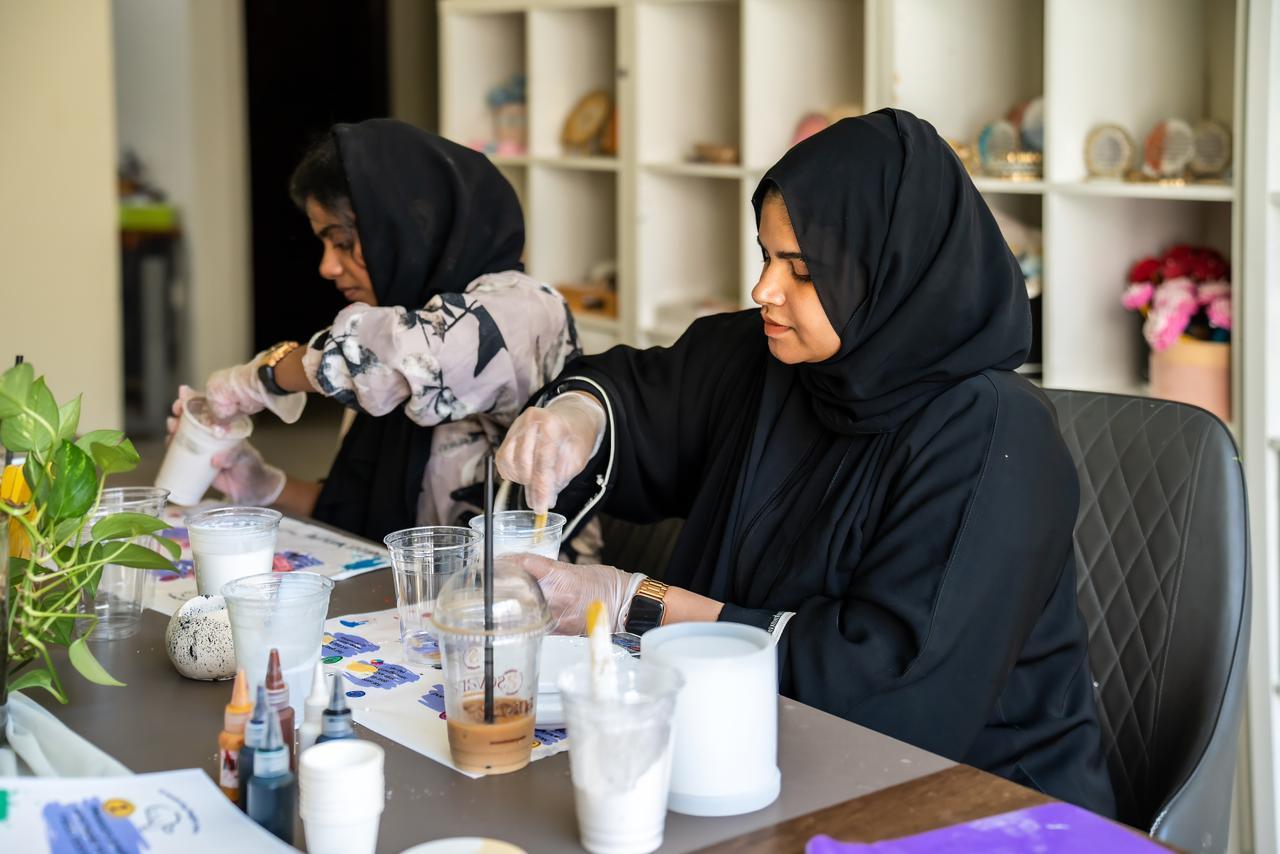 Photo of 2 students in workshop