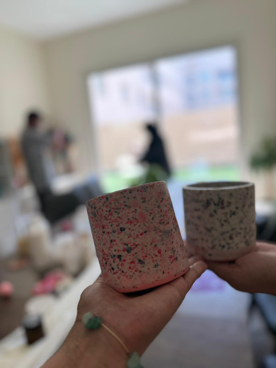 View of 2 Marble jars in hand