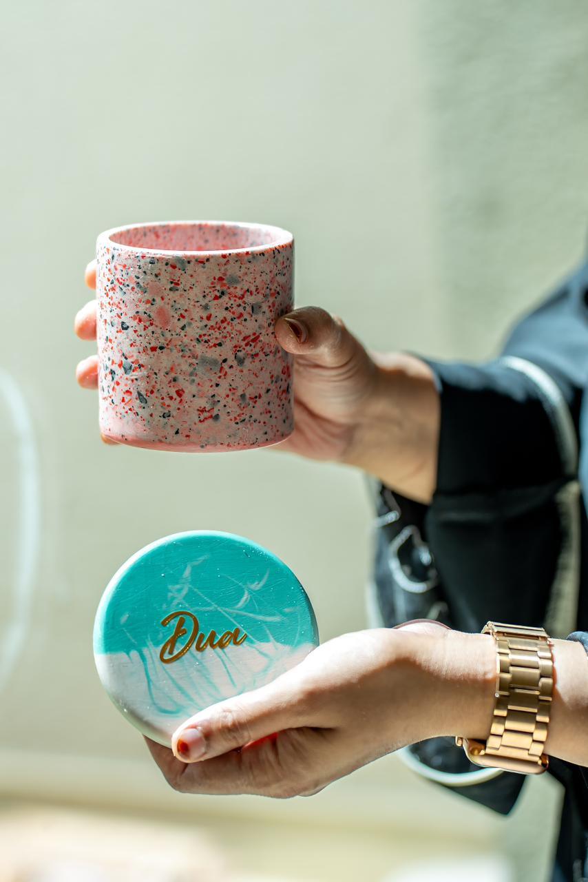 View of a person holding Marble jar and Resin Coaster