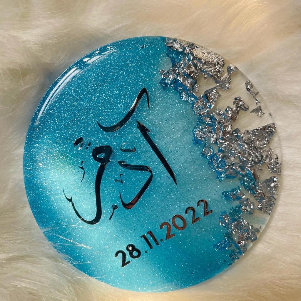 Top view of Blue color Resin magnet with Name and date