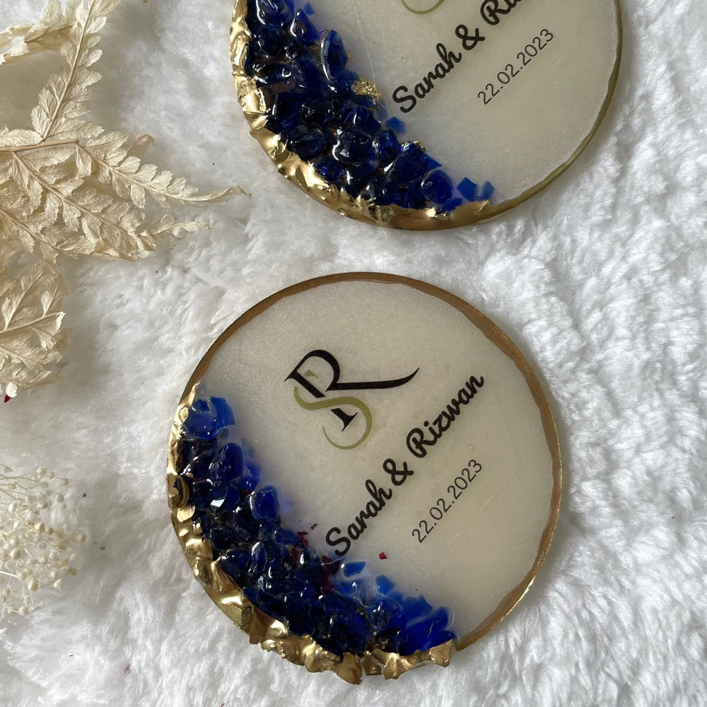 Top  view of 2 resin coasters on soft white surface