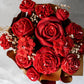 "Top view of red rose scented bouquet by Hyacinth Resin Arts, crafted in epoxy resin with delicate, lifelike red roses encased in a clear resin finish."