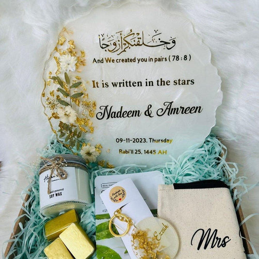 "Top view of an open Wedding/Anniversary Box displaying its contents neatly arranged inside, set on a soft white surface."