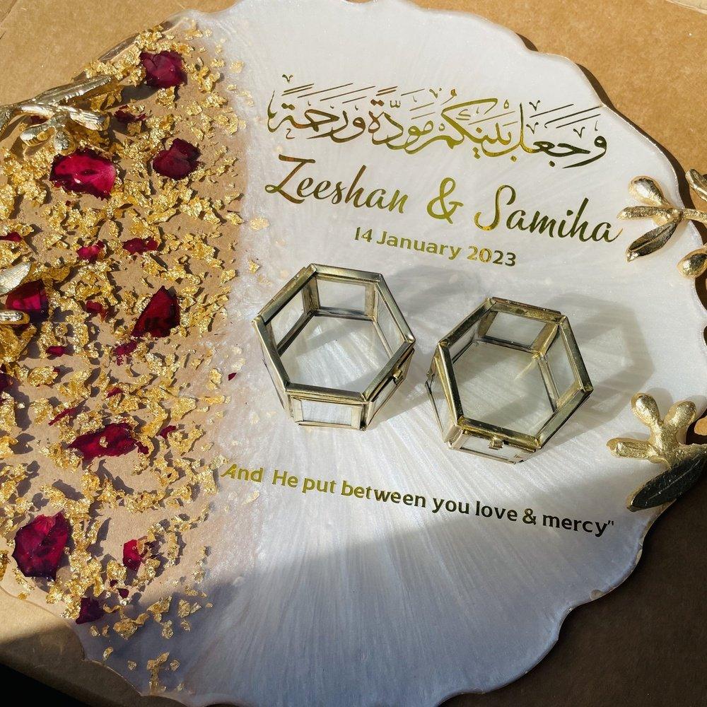 "Top view of two wedding ring trays placed atop matching wedding resin coasters, showcasing intricate designs and elegant craftsmanship."